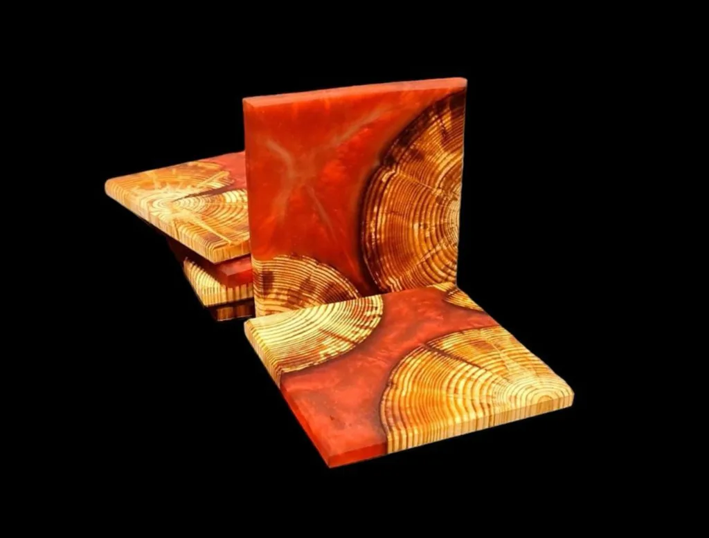 Untersetzer aus Rundholz. Verbunden mit Epoxidharz in der Farbe Carbon Red